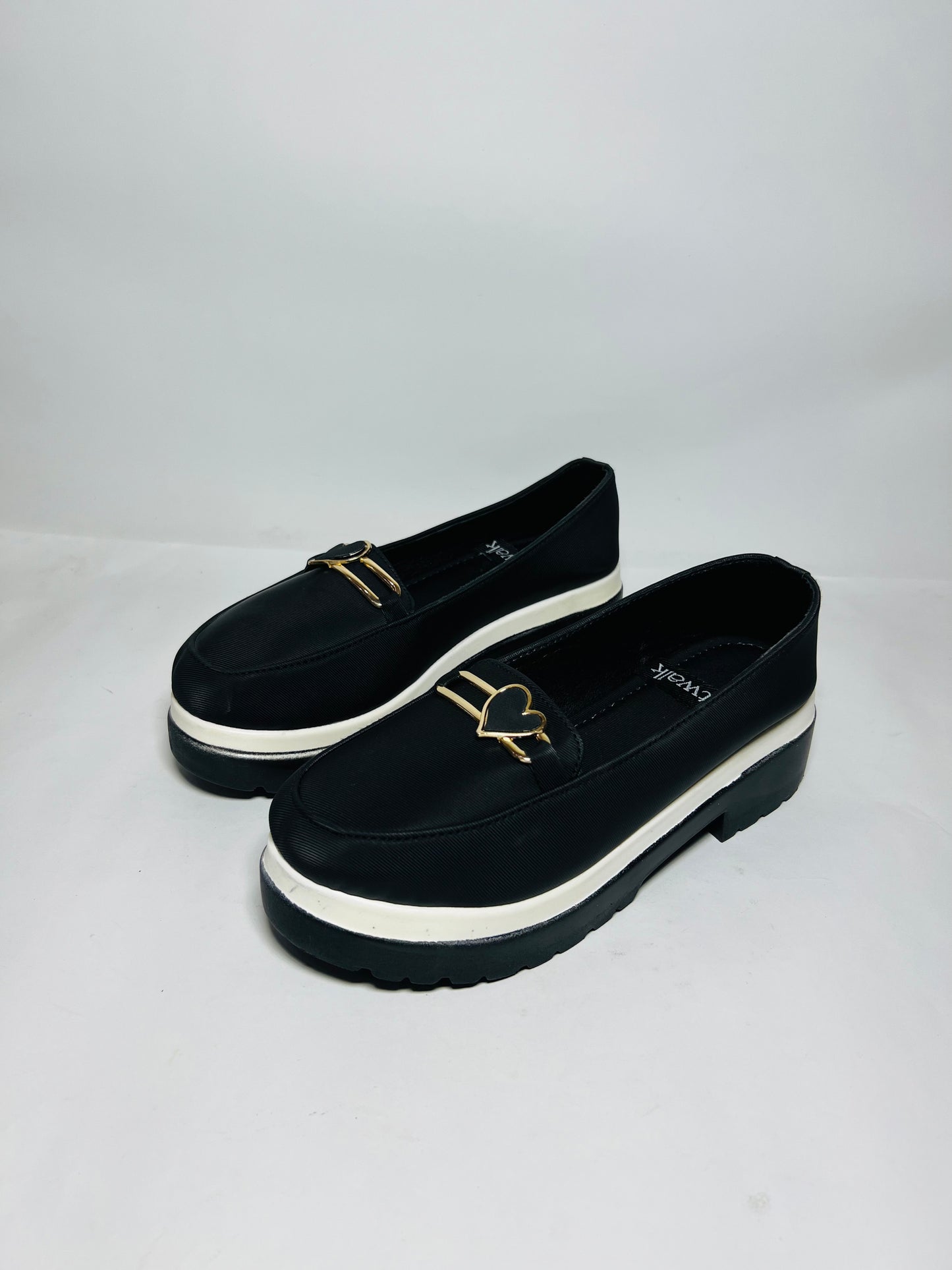 Chunky Sole Loafers: Black Elegance with Modern Hardware.